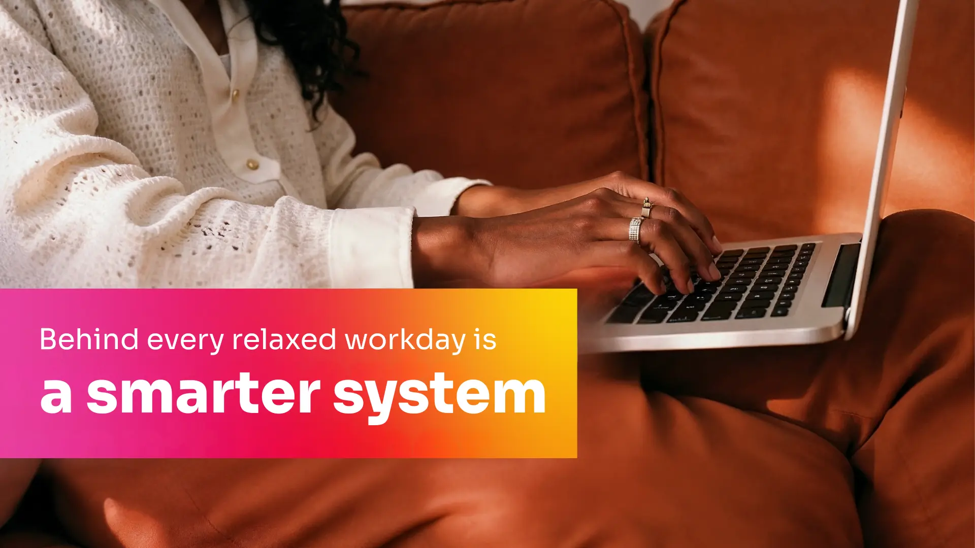 Freelancer sitting comfortably with a laptop on their lap representing balance, focus,